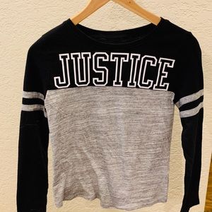 I am selling a long justice T shirt.